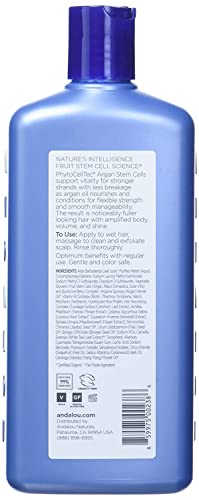 Andalou Naturals Age Defying scalp treatment tube being applied to scalp