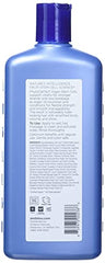 Andalou Naturals Age Defying scalp treatment tube being applied to scalp