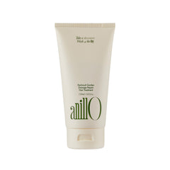 ANILLO Patchouli Garden hair mask bottle being poured for nourishing treatment of damaged hair