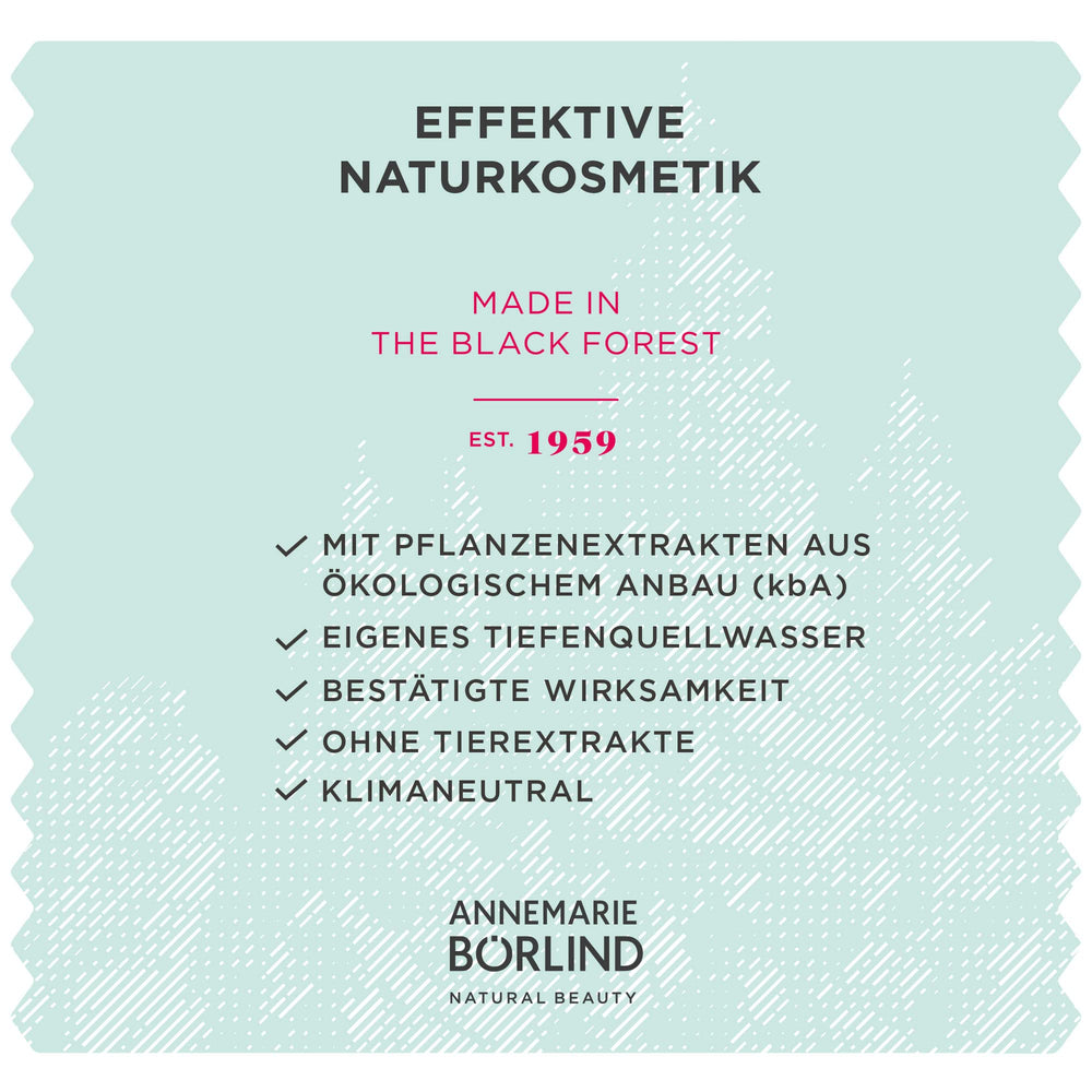 Annemarie Borlind LL Regeneration System Vitality Night Cream placed beside natural ingredients.