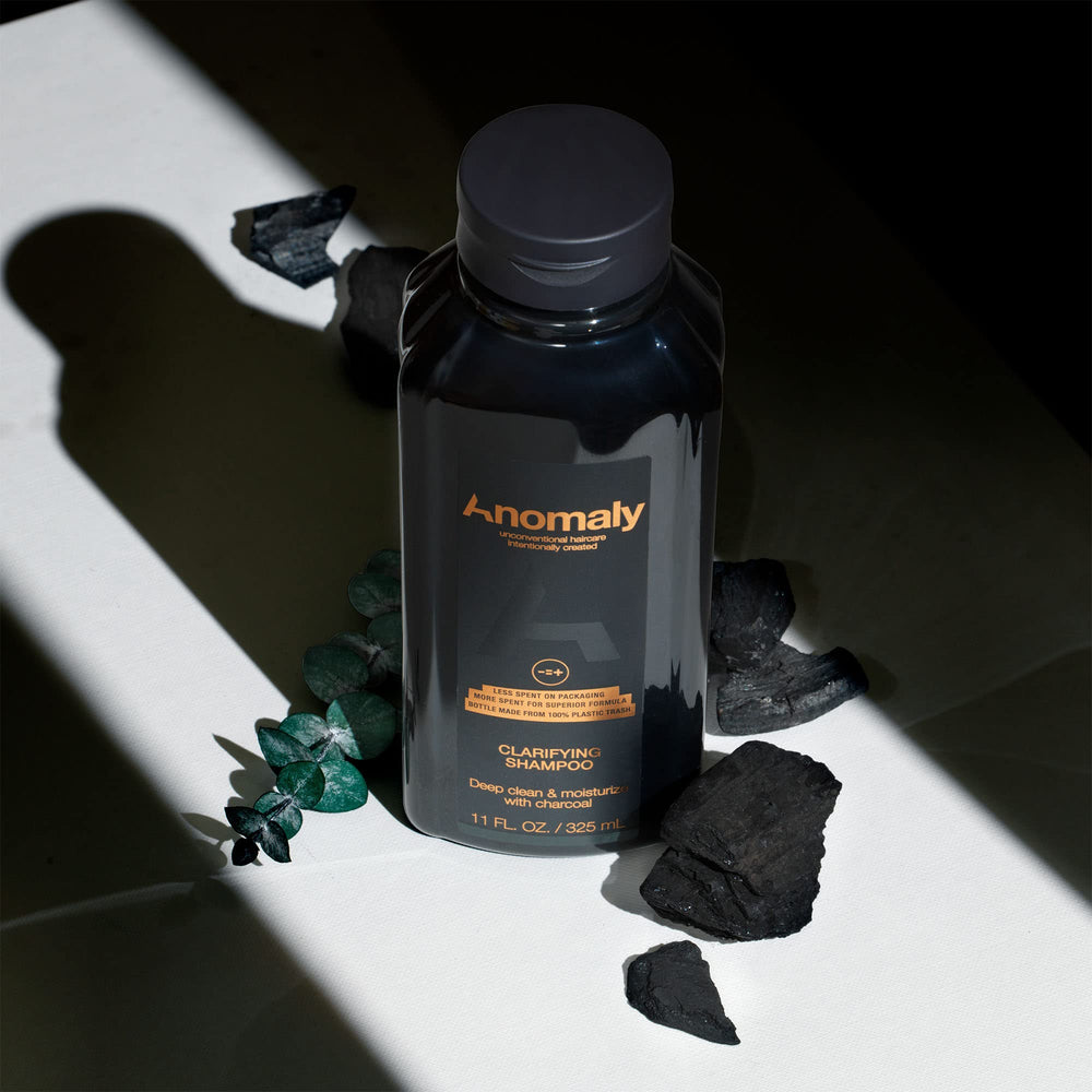 Anomaly bottle label closeup highlighting vegan and sulfate-free formula