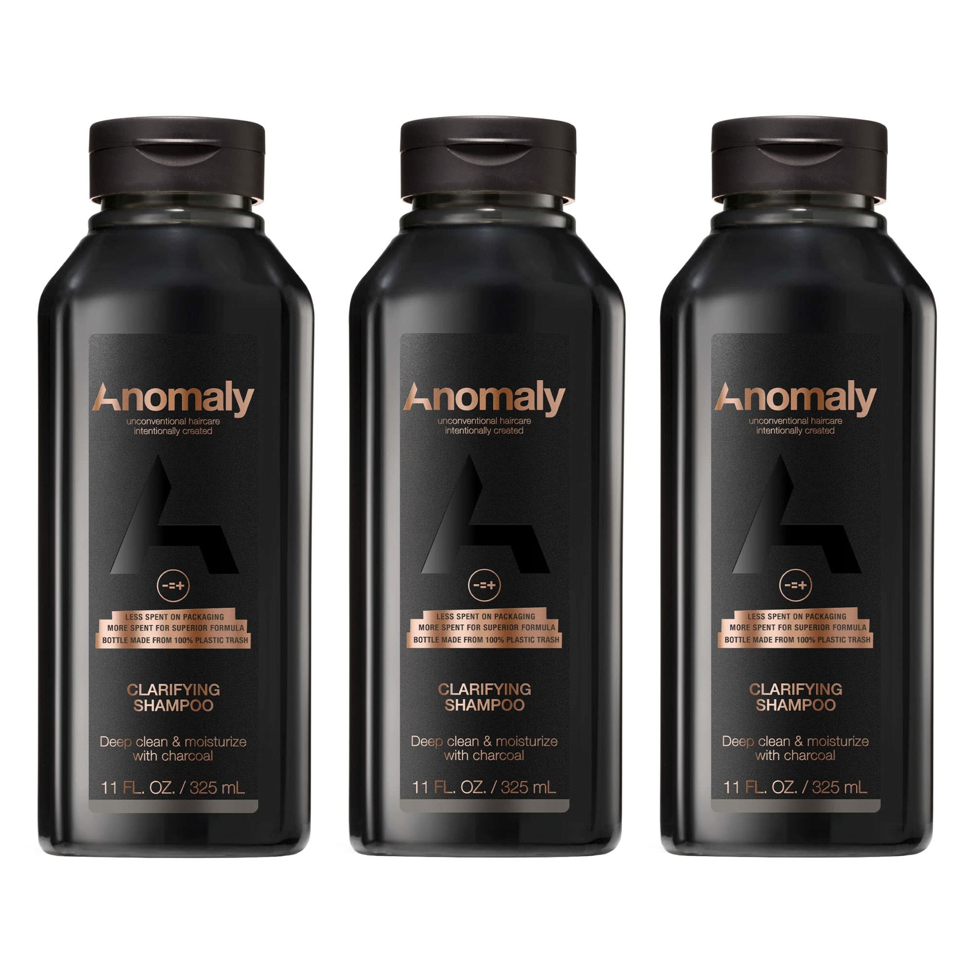 Anomaly clarifying shampoo bottle pour showing charcoal cleanse for buildup control