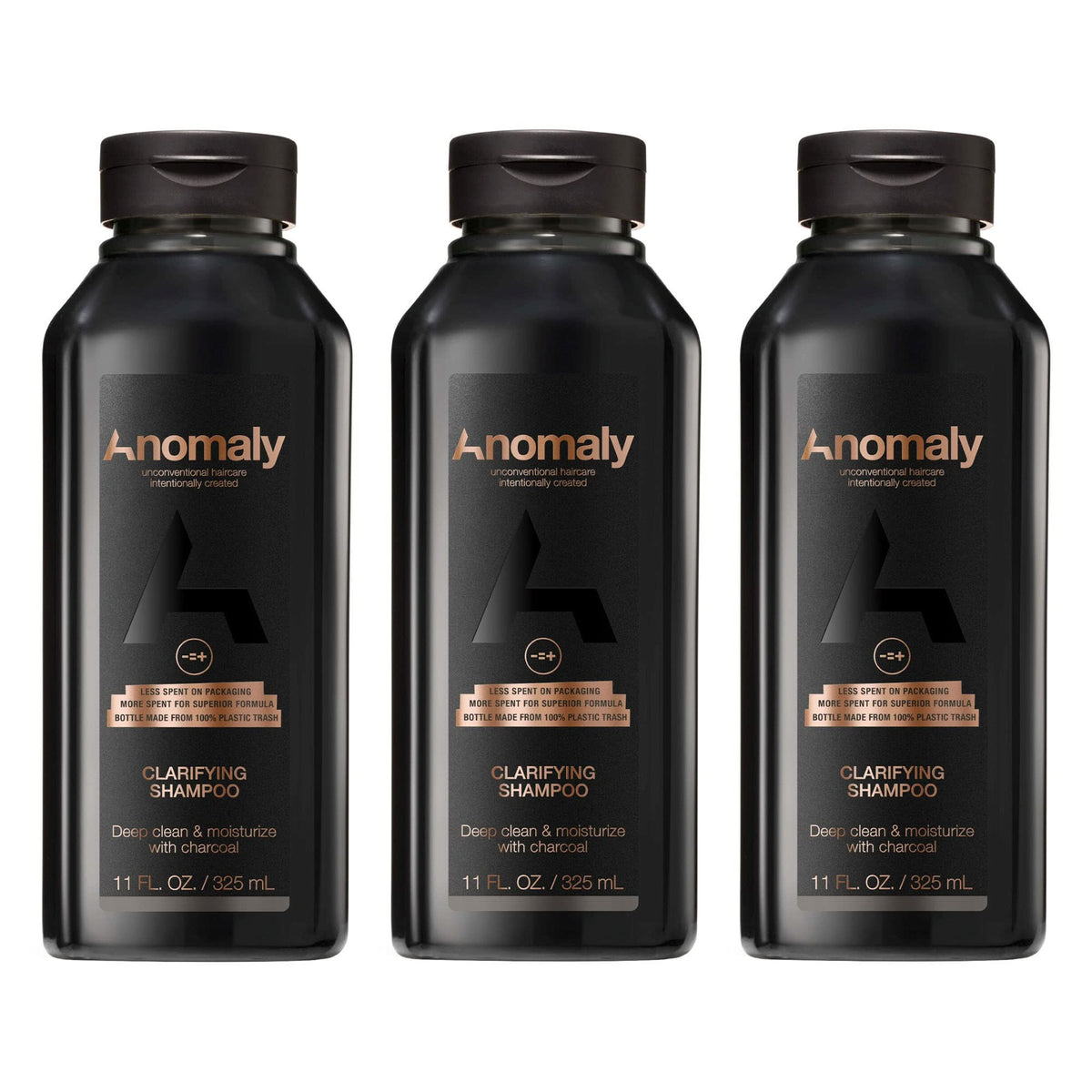Anomaly clarifying shampoo bottle pour showing charcoal cleanse for buildup control