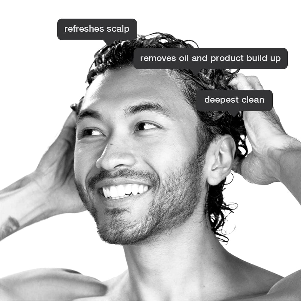 Anomaly Clarifying Shampoo lather on hair demonstrating cleansing action.