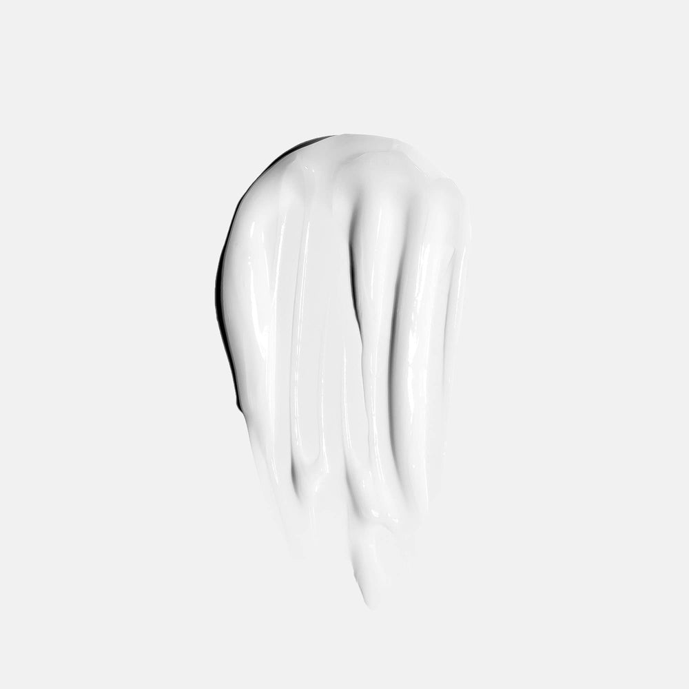 Anomaly Shine anti-frizz effect demonstrated on styled hair.