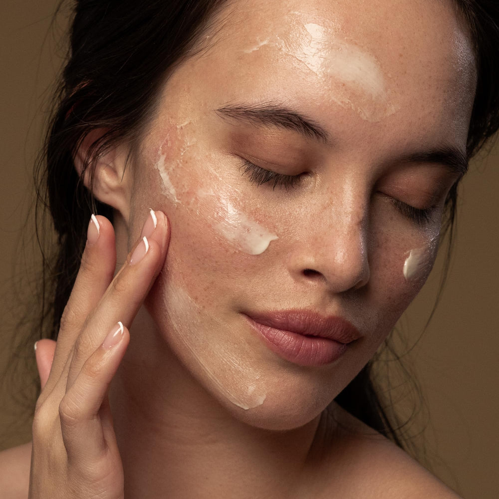 Cream texture dispensed from jar, showcasing rich hydration and comfortable finish.