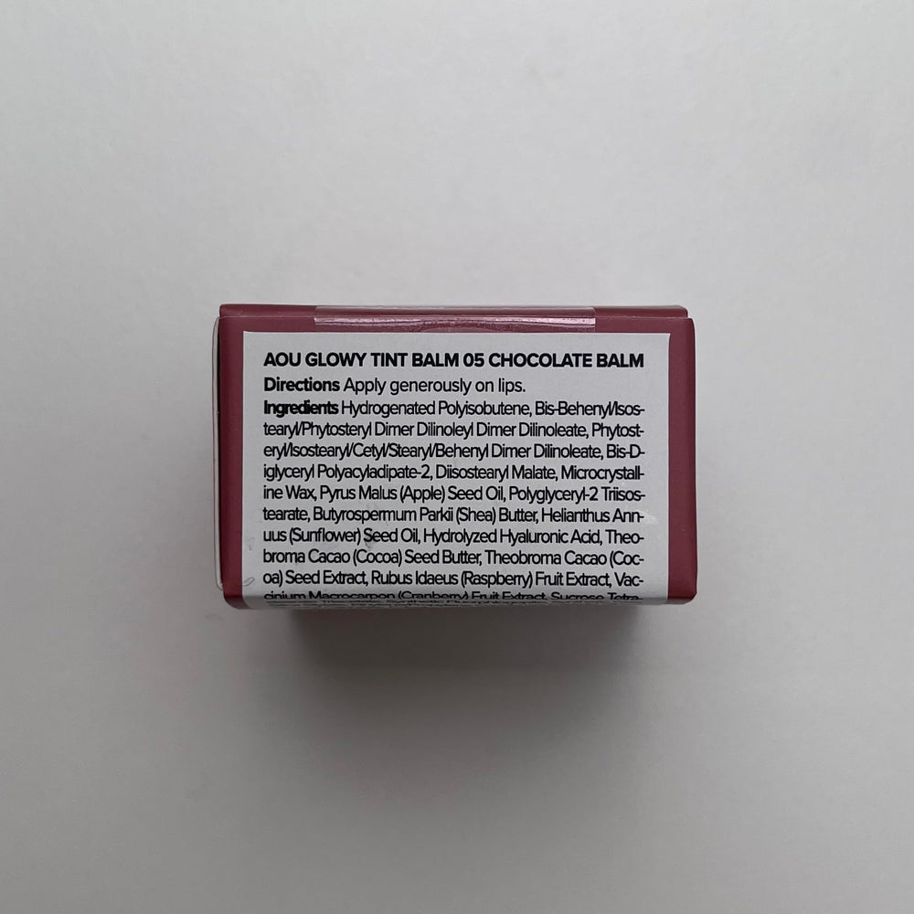 AOU Glowy Tint Balm melts onto lips delivering instant hydration.