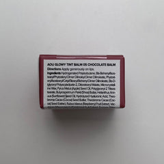 AOU Glowy Tint Balm melts onto lips delivering instant hydration.