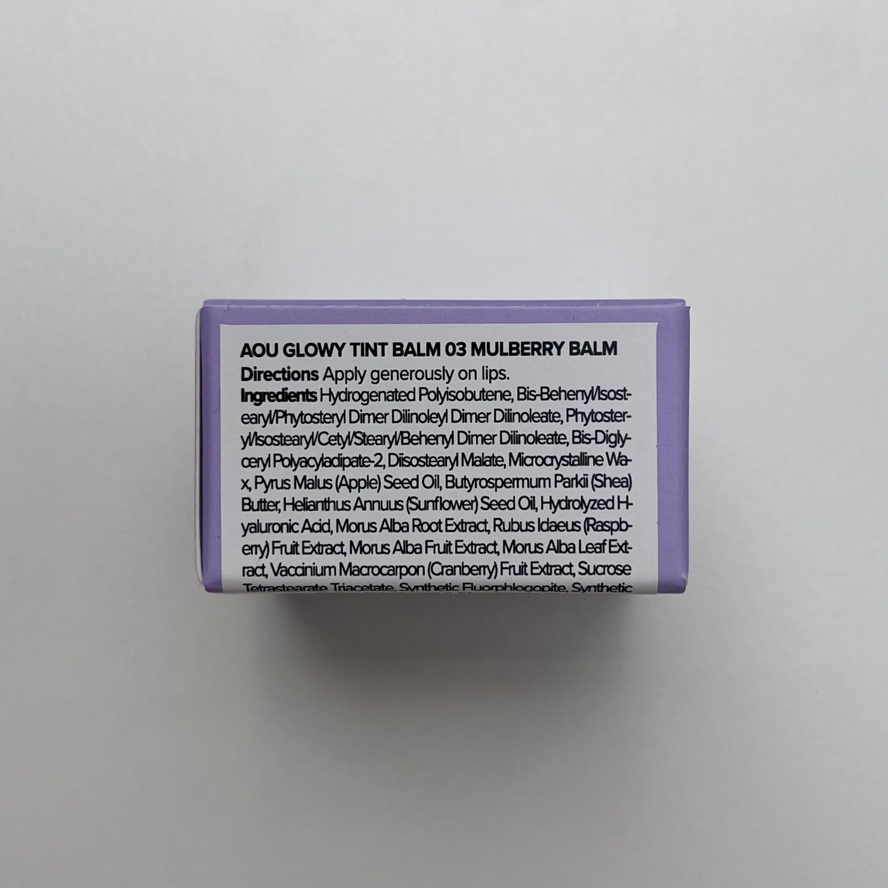 AOU Glowy Tint Balm on lips shows natural gloss and pink shade