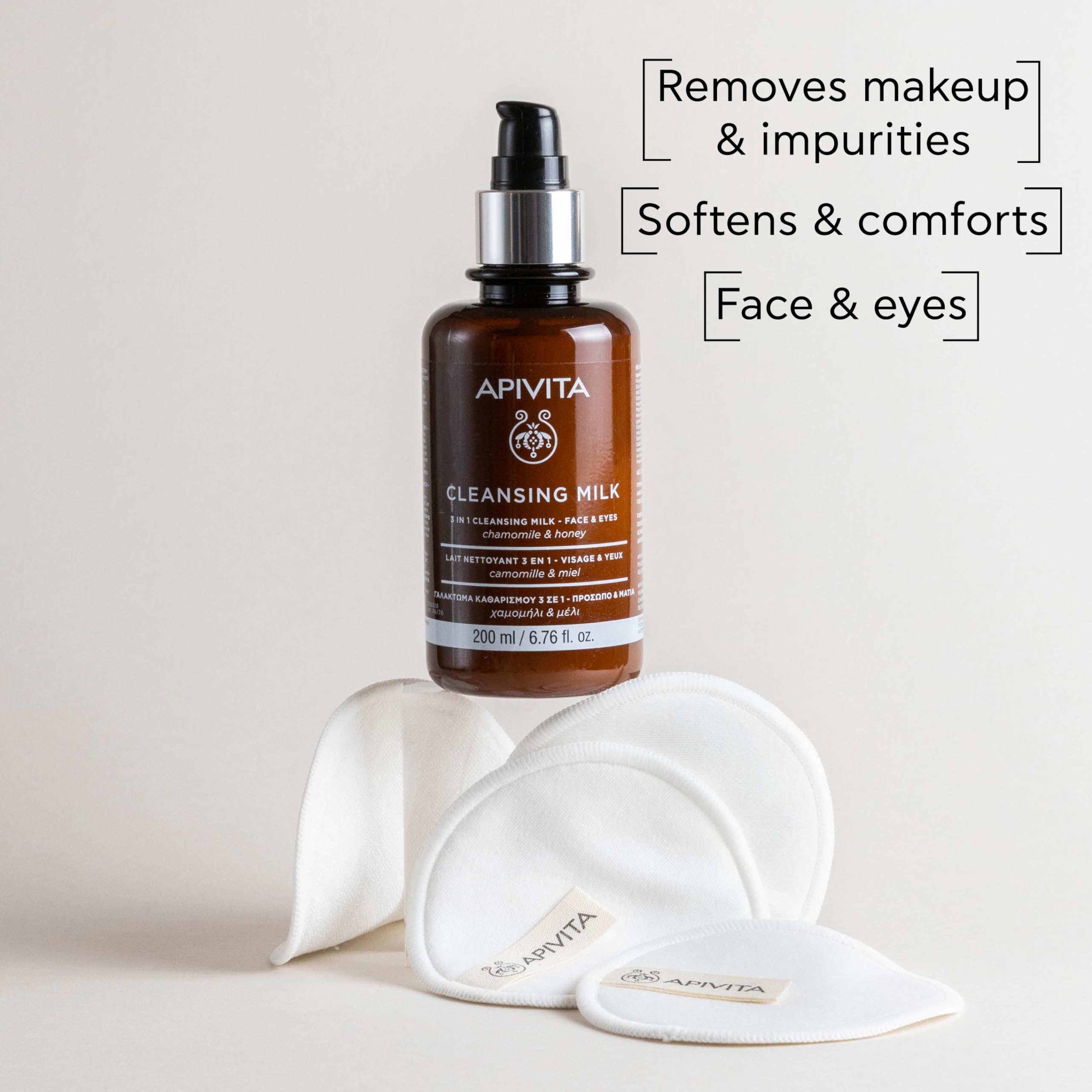 Apivita cleansing milk texture closeup; velvety, hydrating feel for refreshed skin.