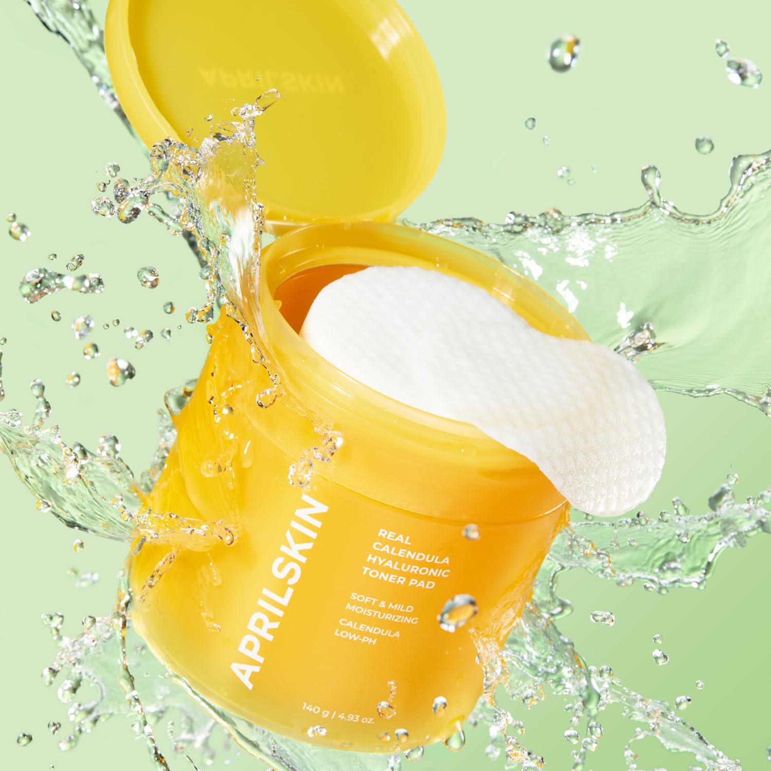 APRILSKIN Calendula PHA Hyaluronic Toner Pads applied with cotton pad for soothing hydration.