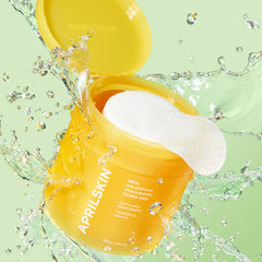 APRILSKIN Calendula PHA Hyaluronic Toner Pads applied with cotton pad for soothing hydration.