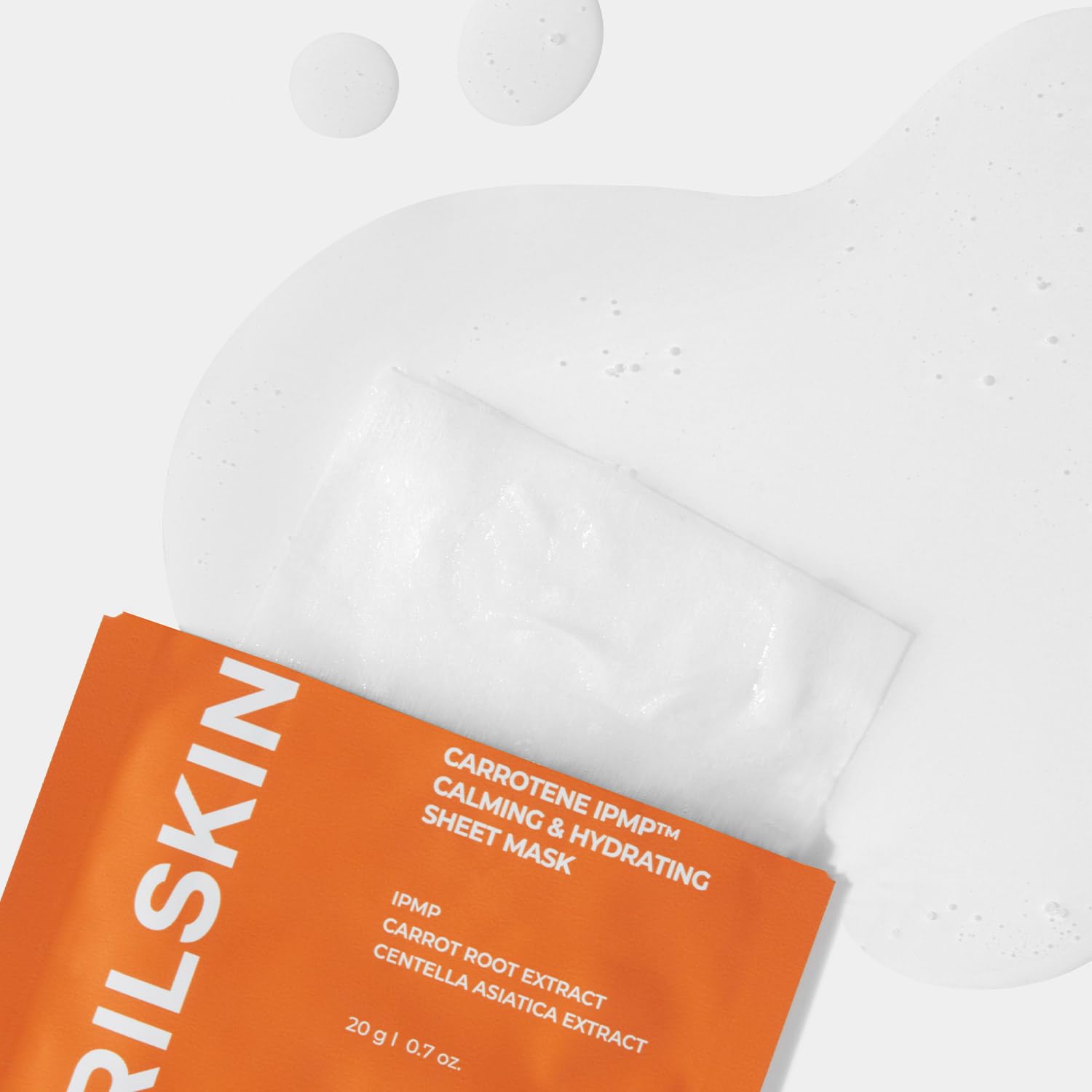 APRILSKIN Carrotene IPMP sheet mask on the cheek showing even coverage