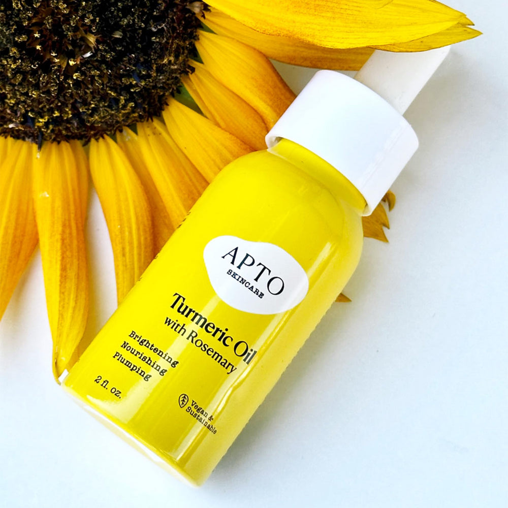 APTO Turmeric Oil with Rosemary glow on skin for dewy look.