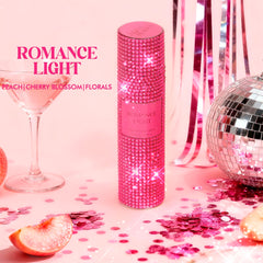 Aqua Blance diamond-embellished bottle catching light for gifting appeal.