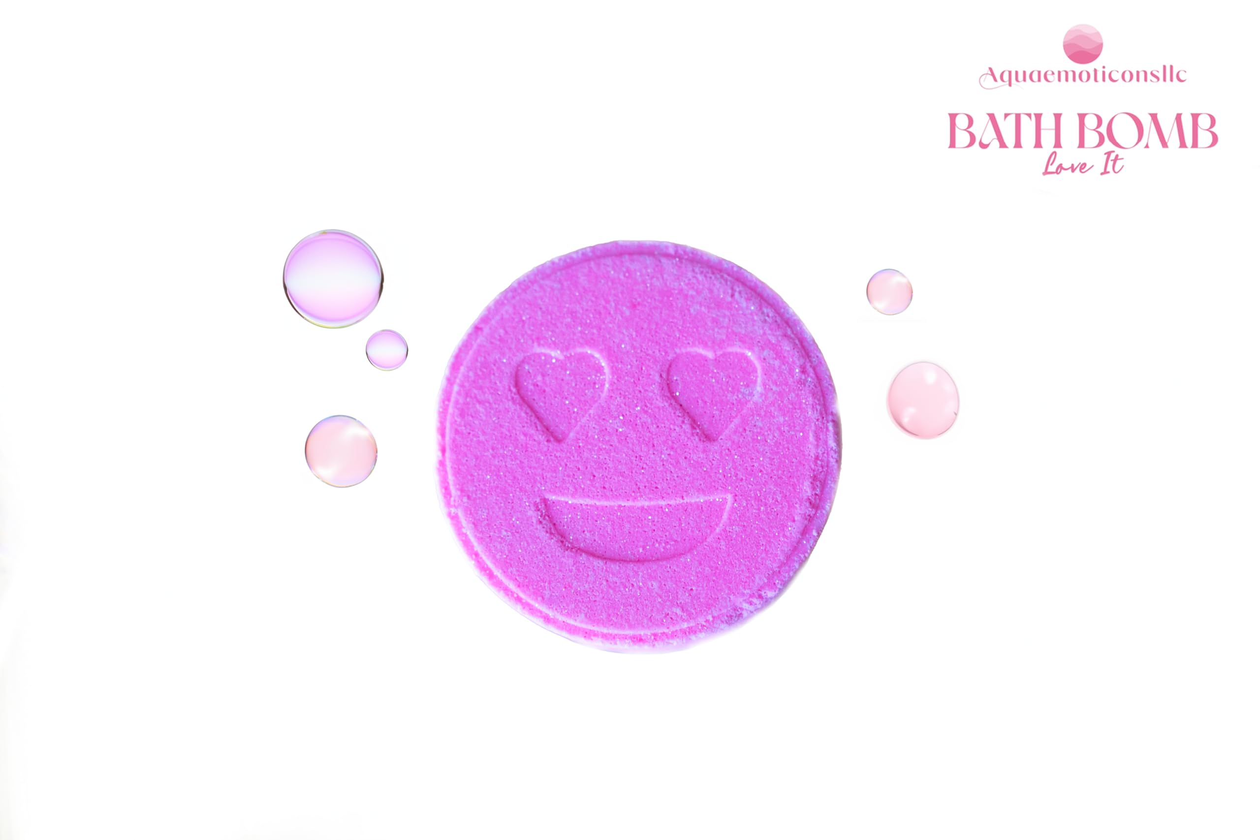 Aquaemoticonsllc Love It Bath Bomb dissolving to infuse pink water with fragrance.