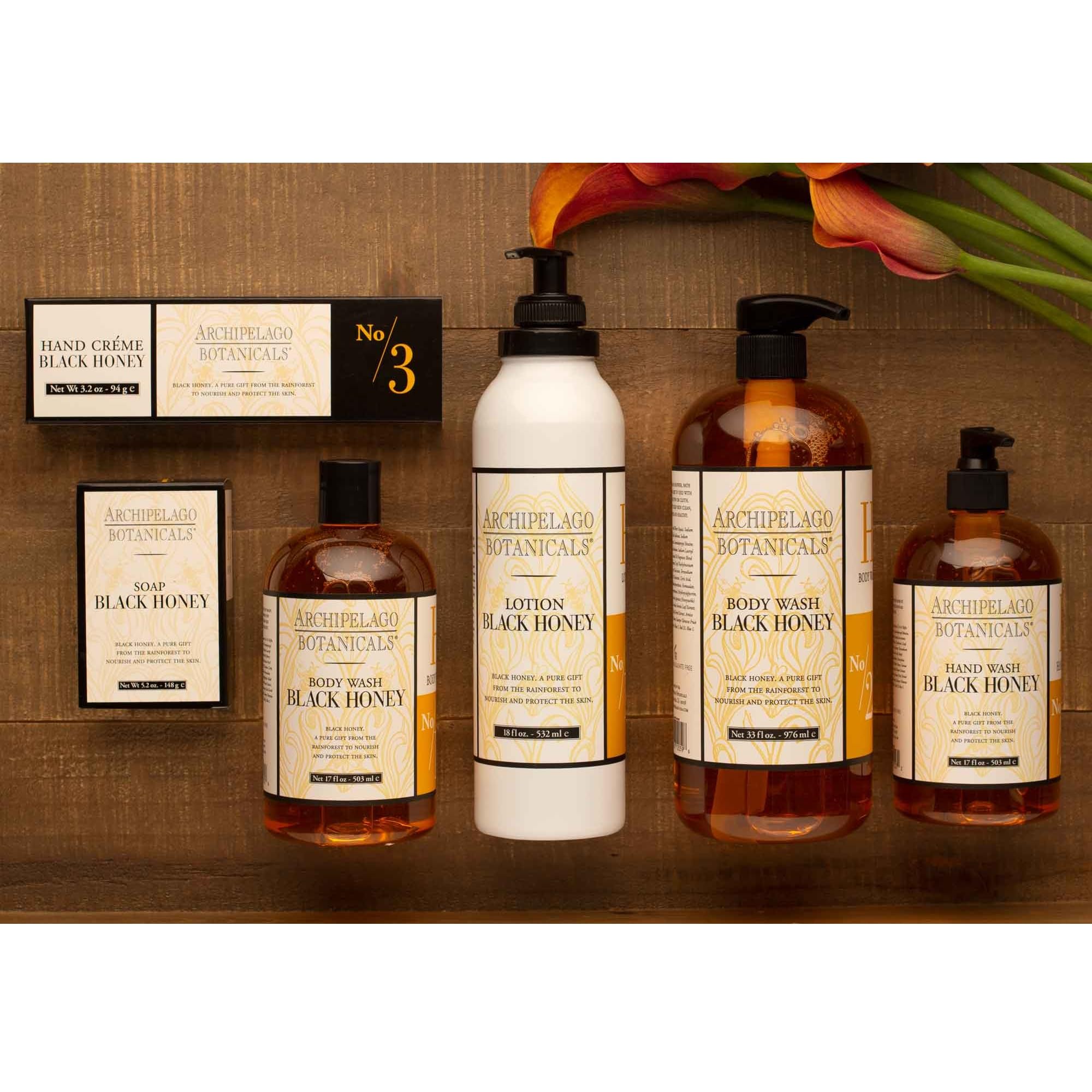 Archipelago Black Honey Lotion being massaged into hands for absorption.