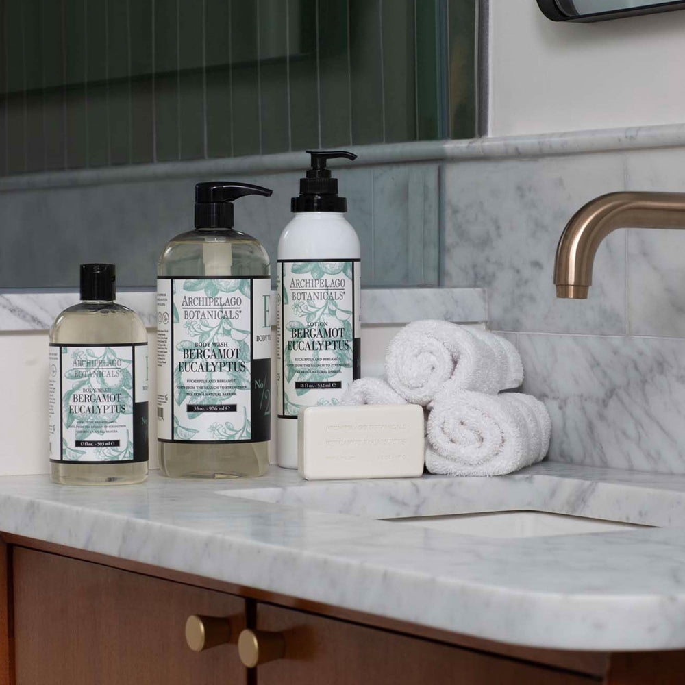 Archipelago Botanicals body wash with sponge creating rich lather for clean skin.