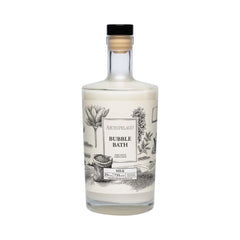 Archipelago Botanicals Luxury Milk Bubble Bath bottle pouring creates rich bubbles for a soothing soak