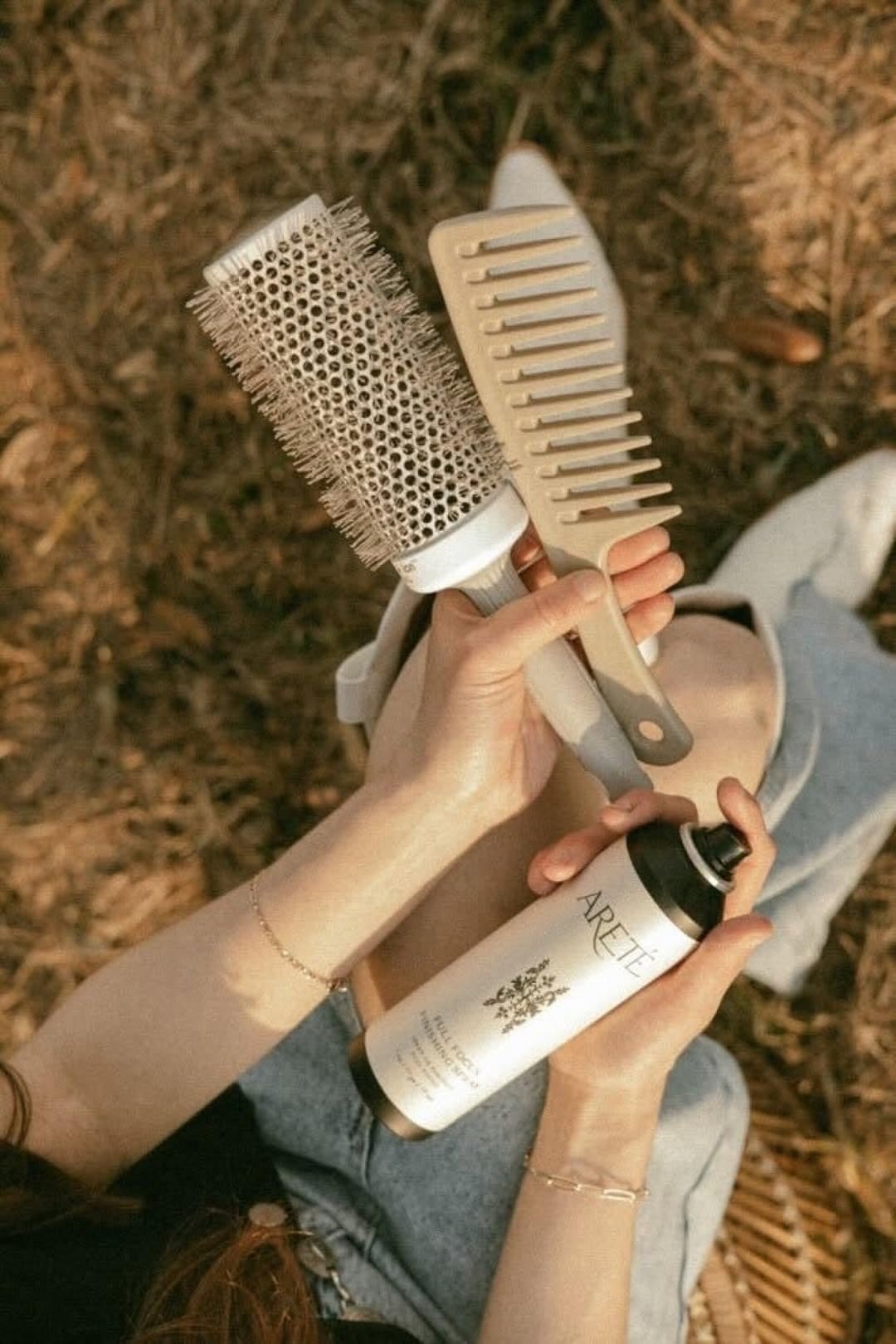 Travel-size ARETÉ Full Focus spray for on-the-go styling.