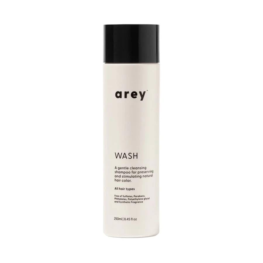 Arey Wash Shampoo bottle pour promotes pigment preservation and healthier strands.