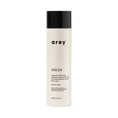 Arey Wash Shampoo bottle pour promotes pigment preservation and healthier strands.