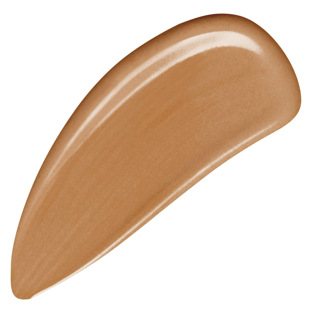 Armani Beauty Luminous Silk Foundation bottle pour demonstrates smooth flow for precise application.