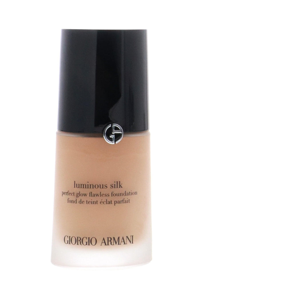 Armani Beauty Luminous Silk foundation pump close-up showing skin-like texture.