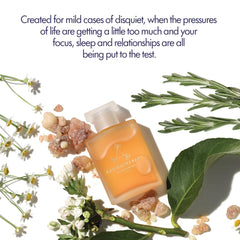 Pouring De-Stress Mind oil to release a soothing aroma during a bath