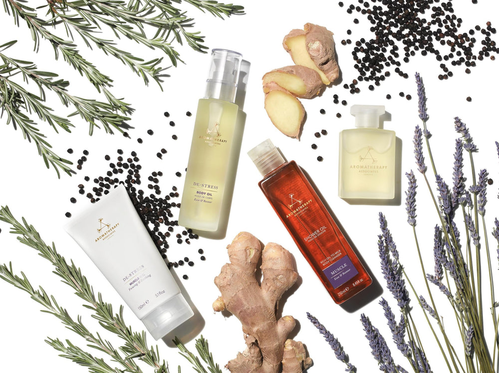 Aromatherapy Associates De-Stress Muscle Shower Oil on a bathroom shelf evokes spa ritual.