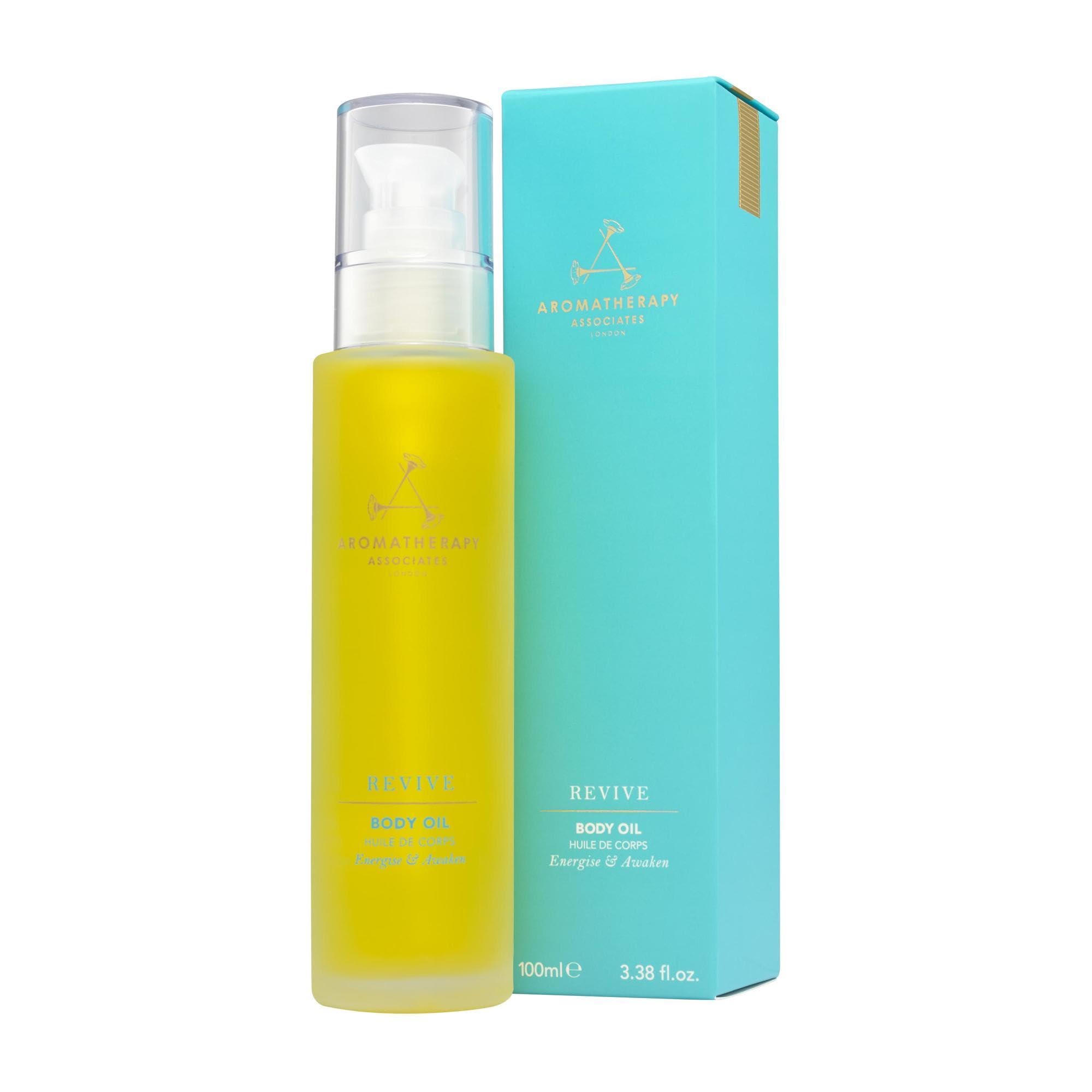 Aromatherapy Associates Revive Body Oil bottle on shelf for energizing skin ritual