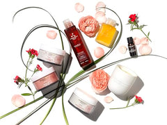 Aromatherapy Associates Rose Shower Oil being massaged in hand as it emulsifies to a milky texture.