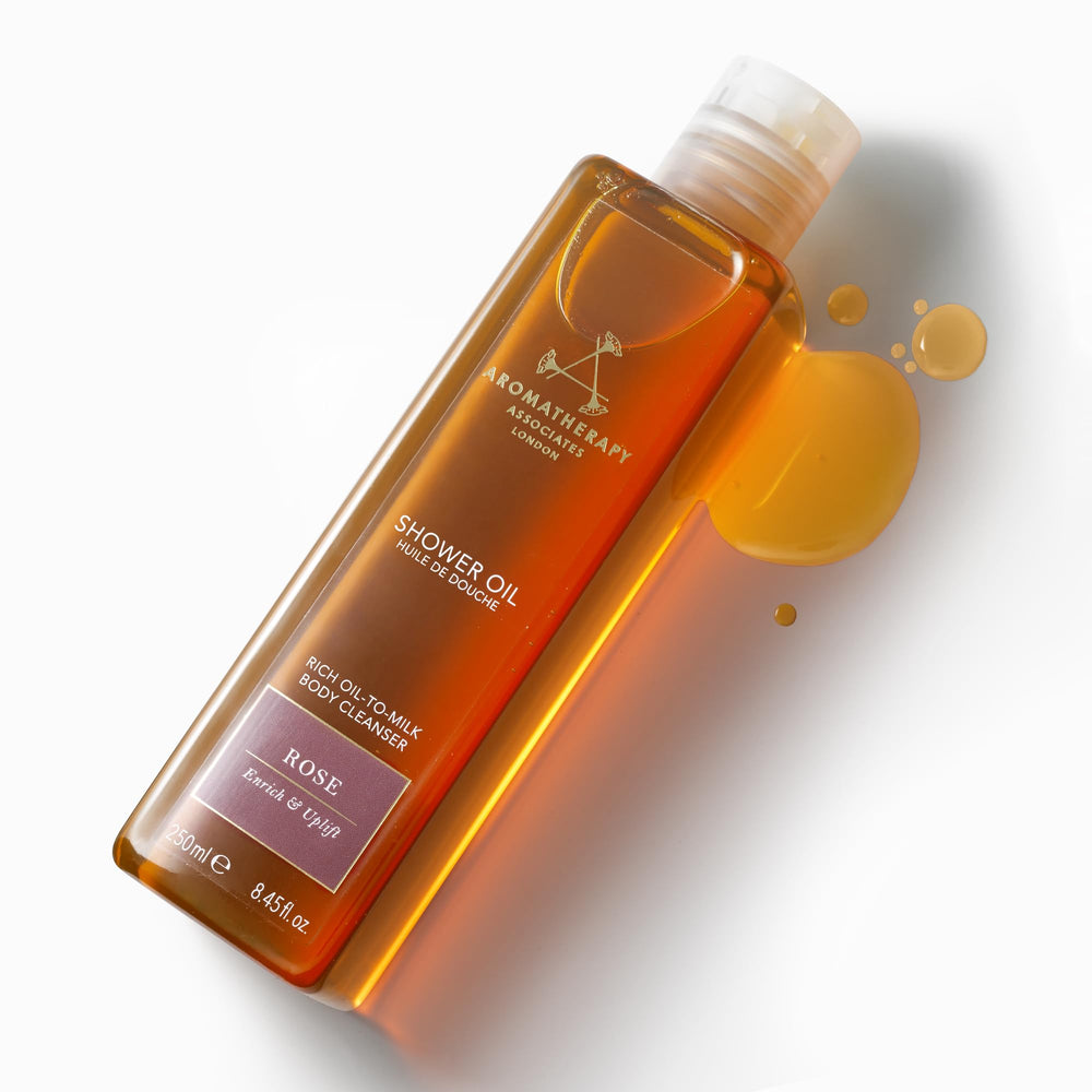Aromatherapy Associates Rose Shower Oil label close-up showing vegan, nut-free, and SLS-free formulation.