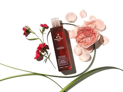 Aromatherapy Associates Rose Shower Oil being poured into a cupped hand for cleansing ritual.