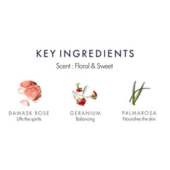 Aromatherapy Associates Rose Shower Oil surrounded by rose petals highlighting uplifting scent.