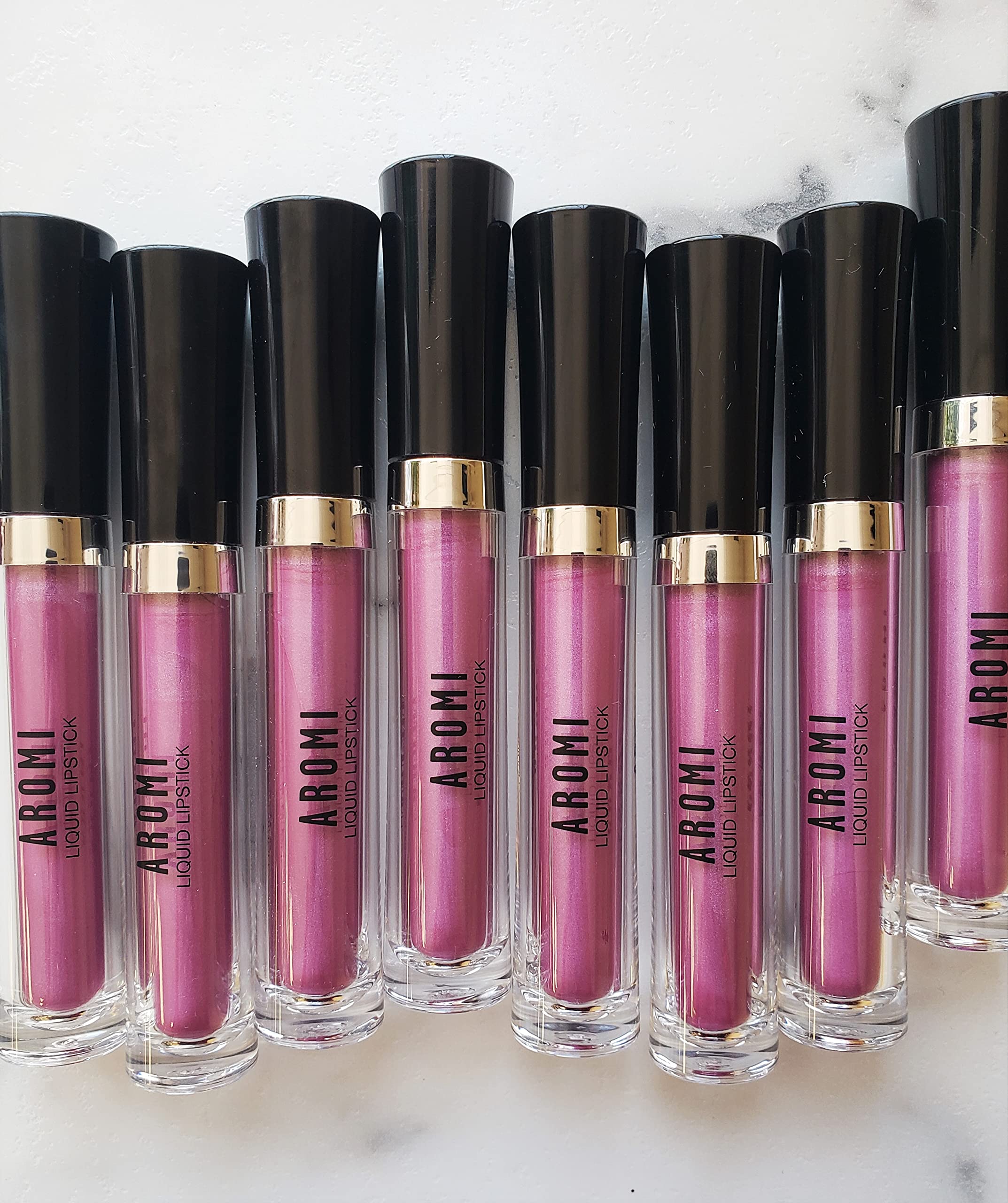 Aromi Berry Fuchsia applicator applying color smoothly