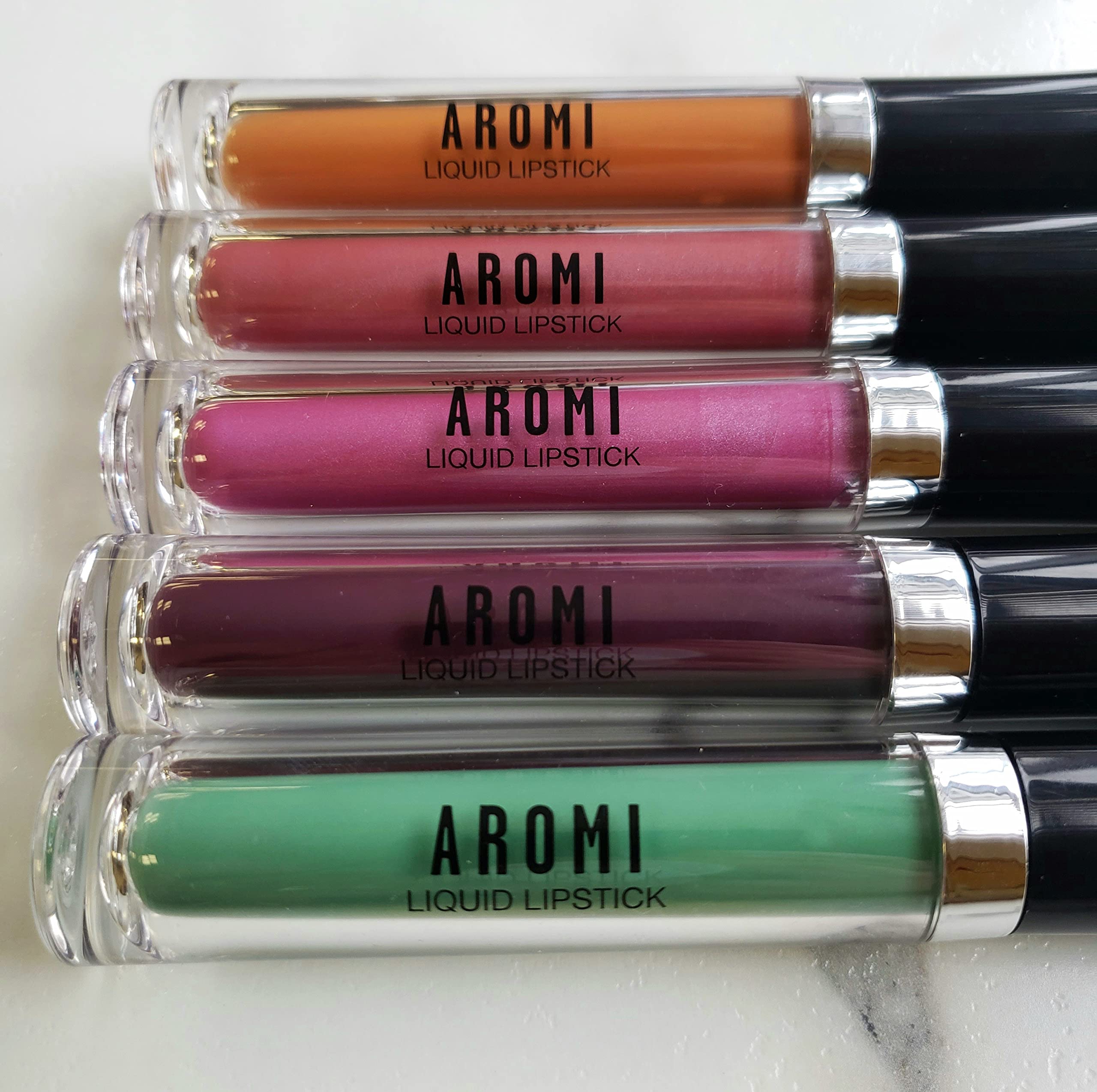 Aromi Berry Fuchsia on lips for vibrant look