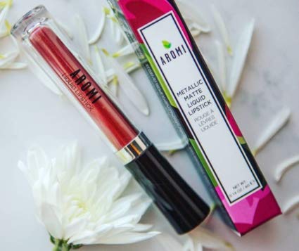 Aromi close-up highlights metallic finish that catches light from every angle on lips