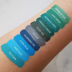 Aromi Emerald Green lipstick on lips demonstrates smooth glide