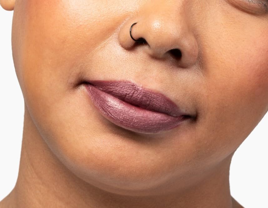 Aromi Handcrafted lipstick bottle conveys artisanal craftsmanship.