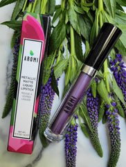 Aromi Violet Plum swatch on skin demonstrates buildable color and shimmer.