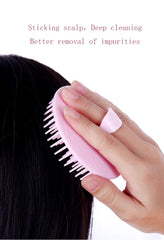 Aroveea scalp brush closeup on handle for precise control during scalp cleansing.