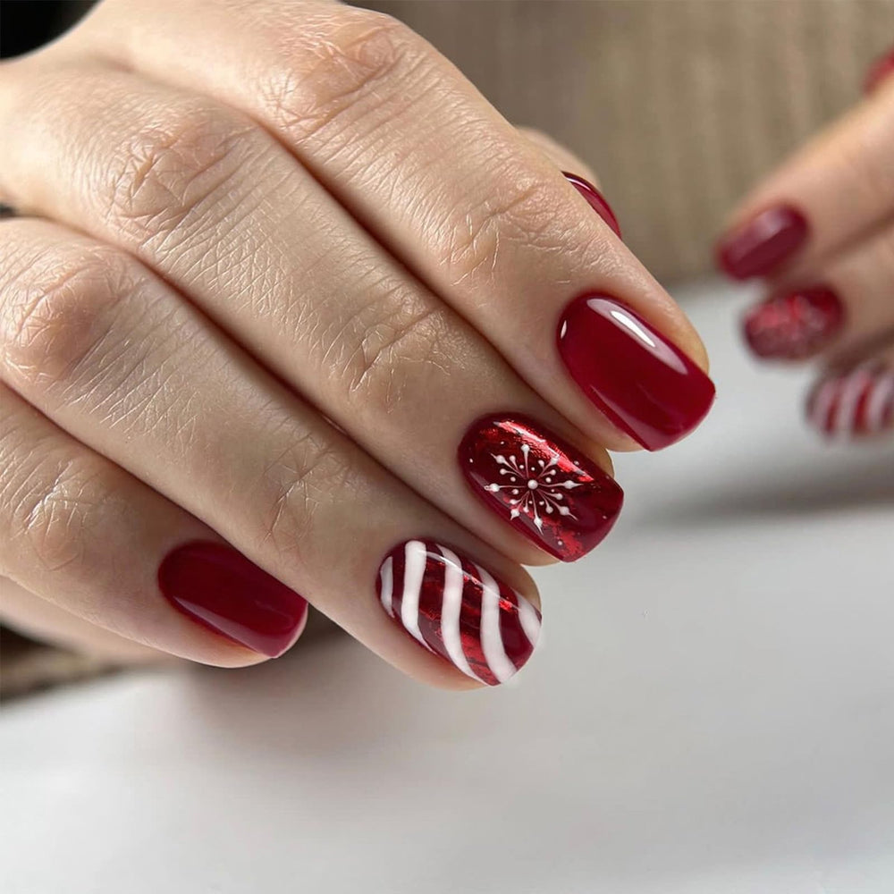 AROVFAM Christmas snowflake nails with glossy red curve line for festive style.