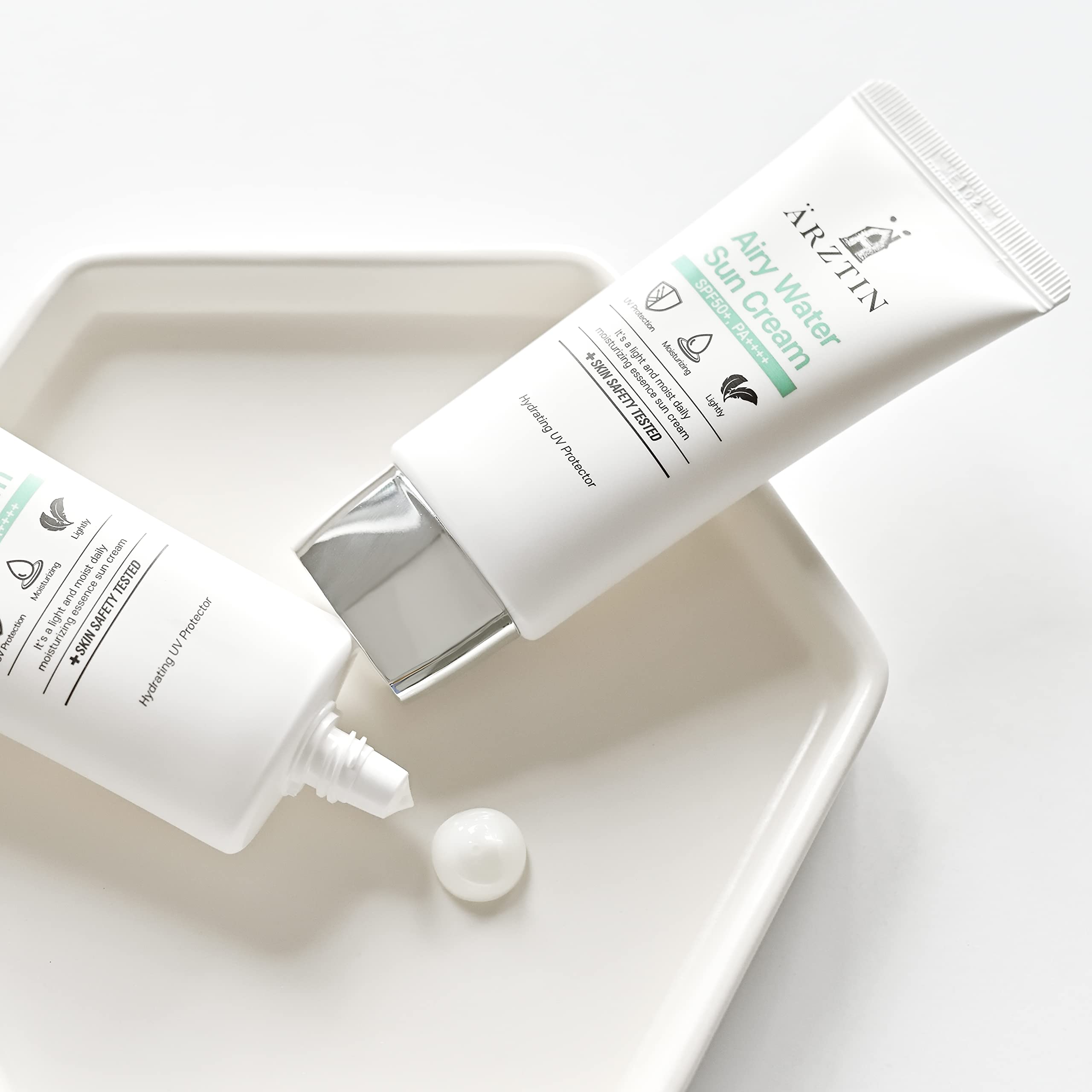 ARZTIN Airy Water Sun Cream packaging box photographed for premium skincare routine.