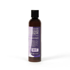 AS I AM Rice Water Conditioner bottle during hands-on application demonstrates easy wet detangling.