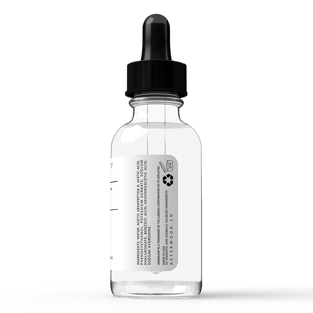 Hand applying Asterwood Argireline Serum to the cheek.