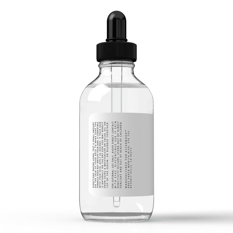 Label close-up on Asterwood product emphasizing fragrance-free vegan formula.