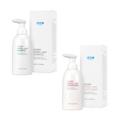 A.t.o.m.y Herbal Conditioner bottle close-up highlights hydration for silky hair and refreshed body.