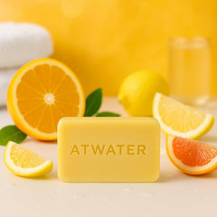ATWATER Alpine Expedition packaging close-up in yellow steamer trunk, premium skincare look.