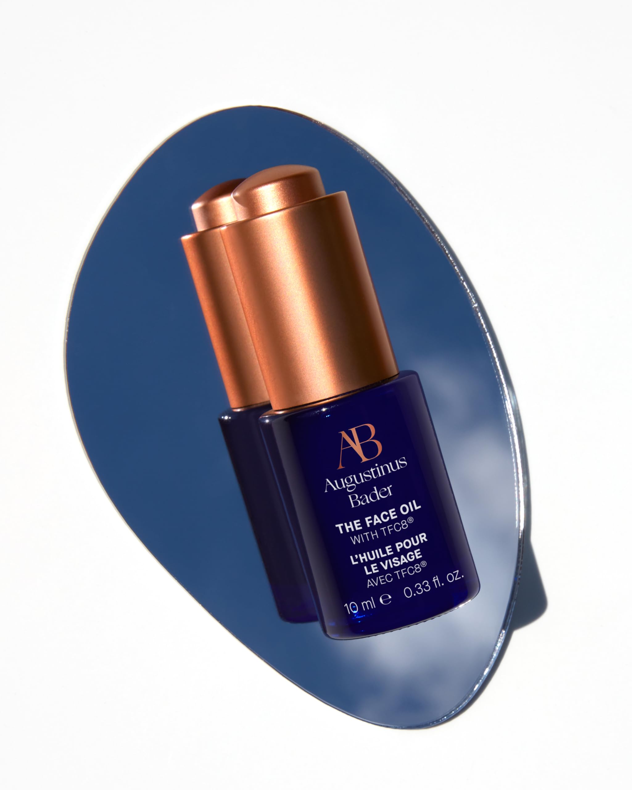 Augustinus Bader The Face Oil texture drop illustrating light, fast-absorbing hydration for all skin types.
